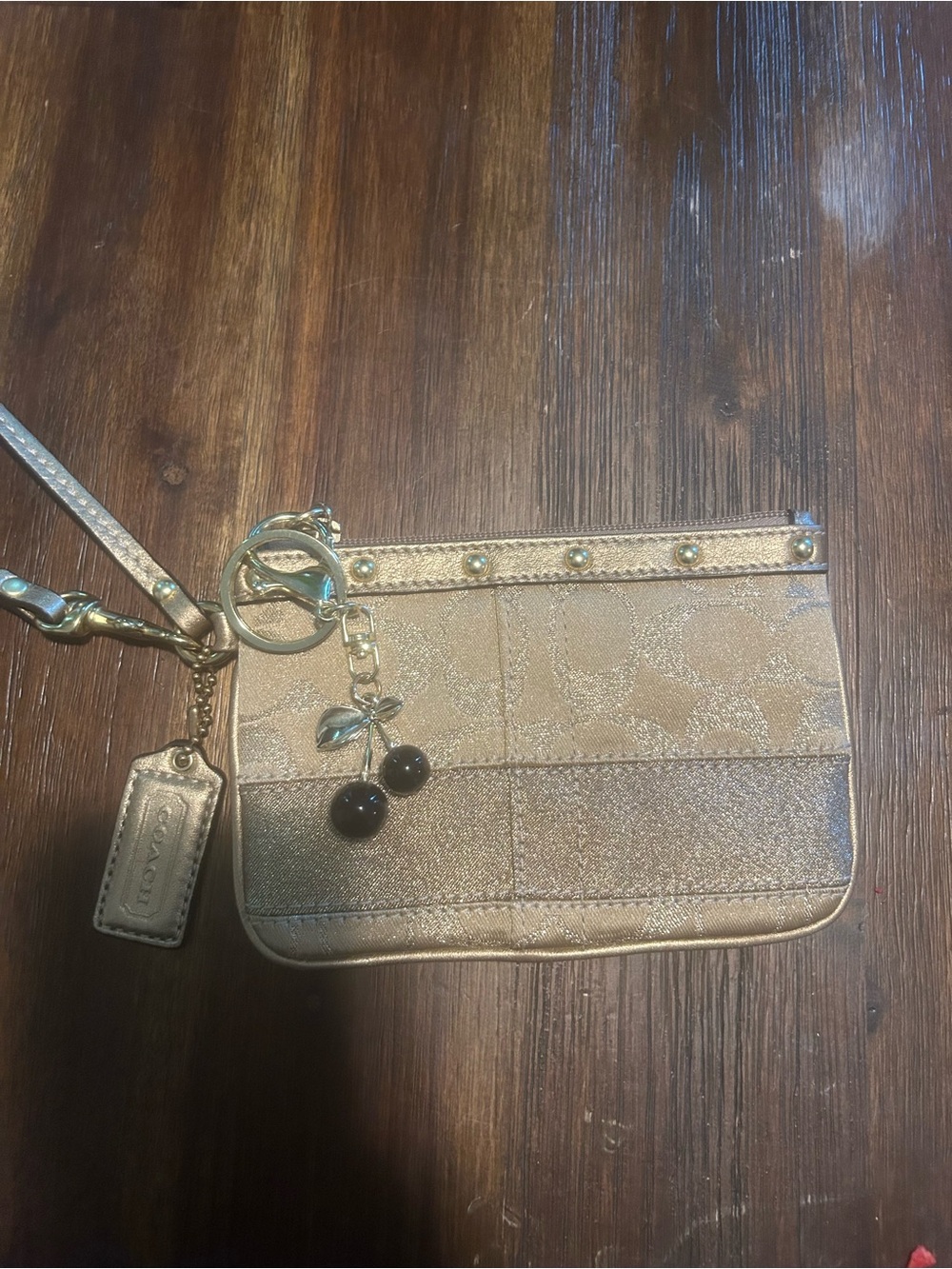 Coach Gold Leather Wristlet with Pink Lining